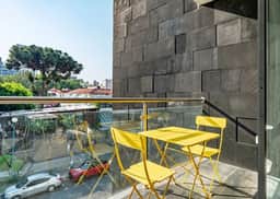 Stylish Urban Retreat w/ Balcony & Coworking Space - Image 2