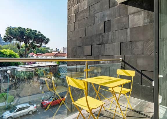 Stylish Urban Retreat w/ Balcony & Coworking Space - Image 2